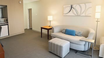 Desk, laptop workspace, blackout drapes, iron/ironing board