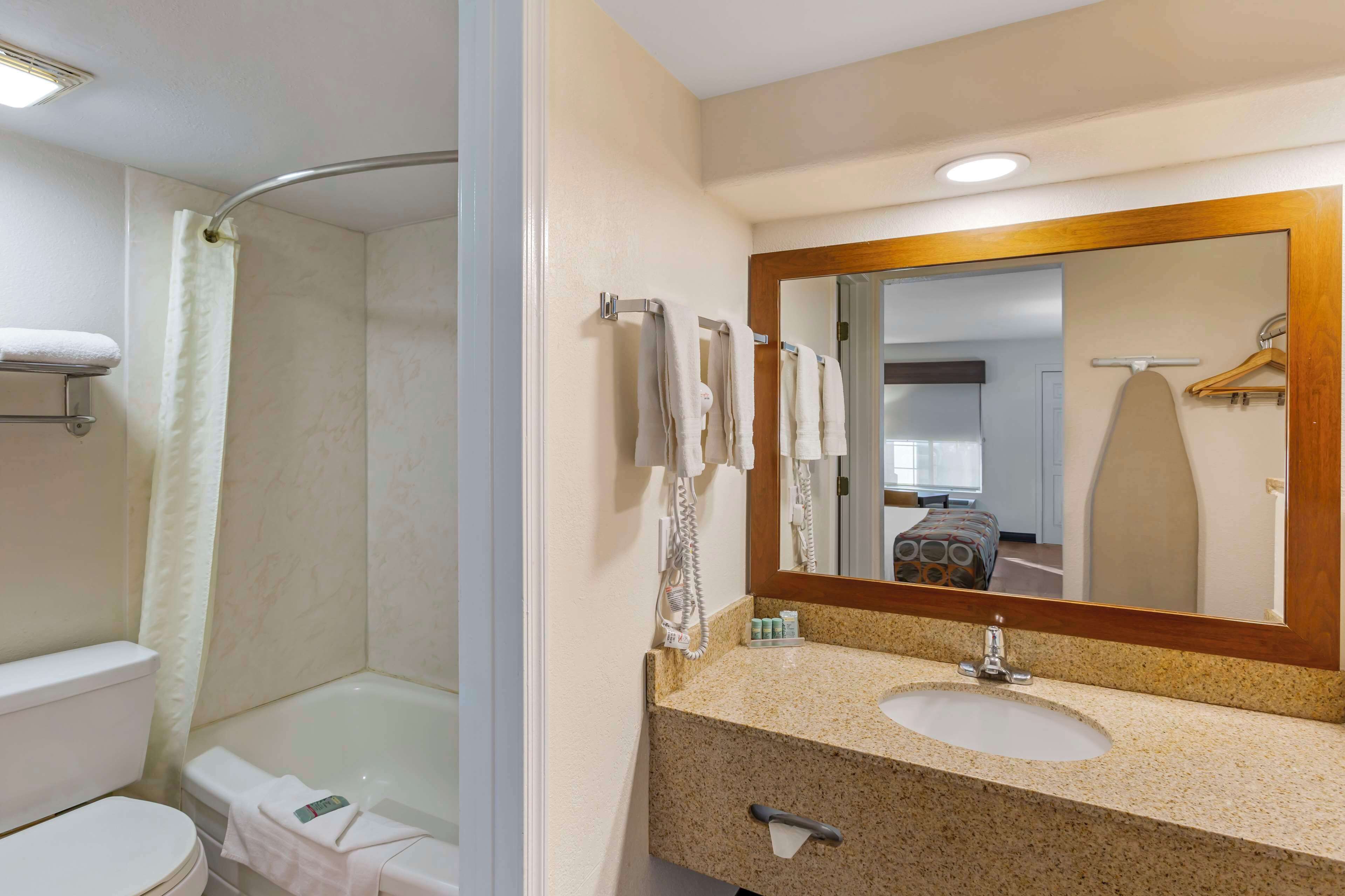 standard room, 1 king bed, non smoking, refrigerator & microwave | bathroom | free toiletries, hair dryer, towels, soap