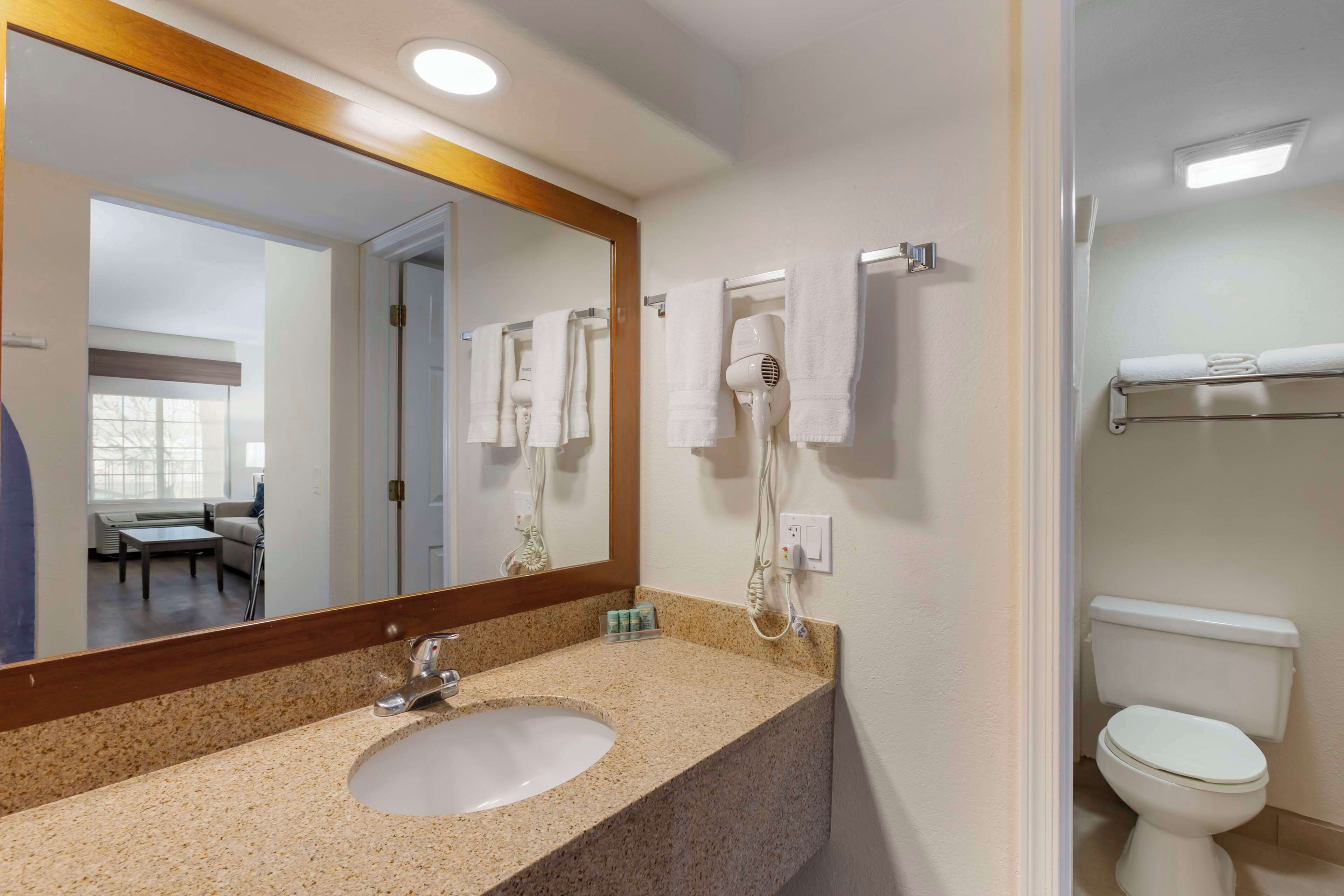 suite, 1 queen bed, non smoking, refrigerator & microwave (separate living room;with sofabed) | bathroom | free toiletries, hair dryer, towels, soap