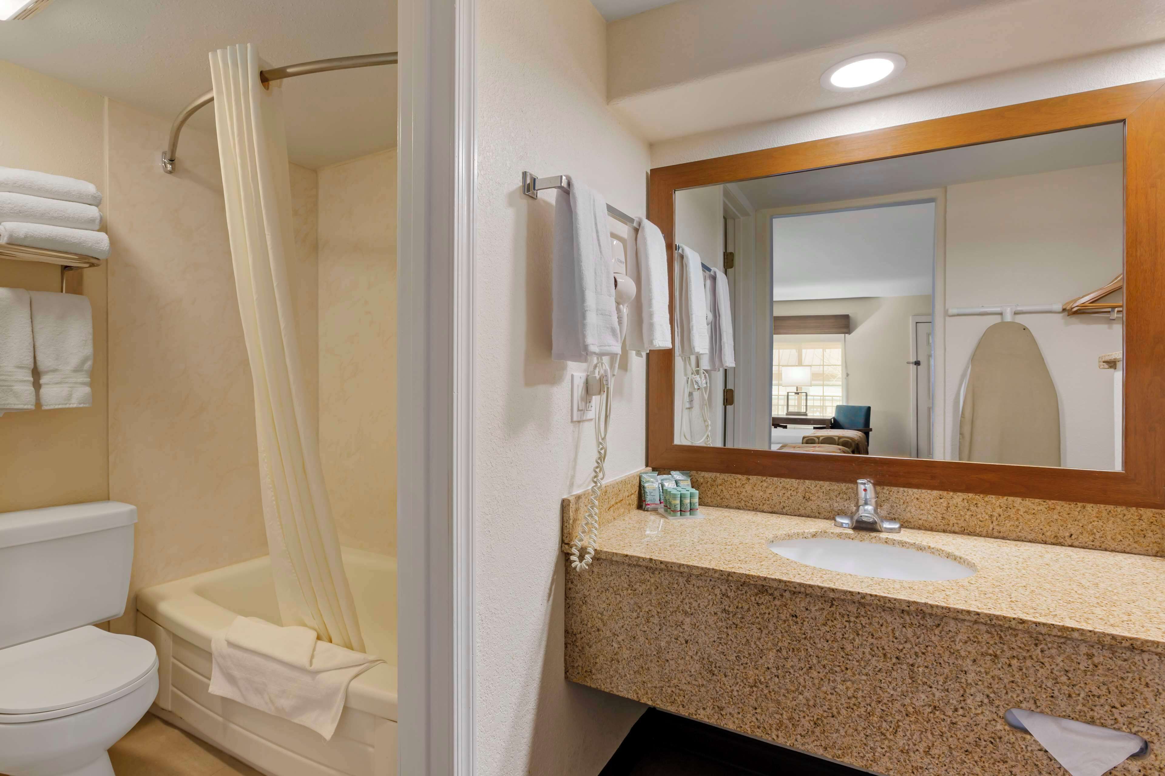 suite, multiple beds, non smoking, refrigerator & microwave | bathroom | free toiletries, hair dryer, towels, soap