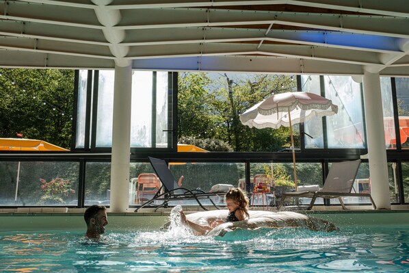 Indoor pool, open 9:00 AM to 10:00 PM, pool loungers