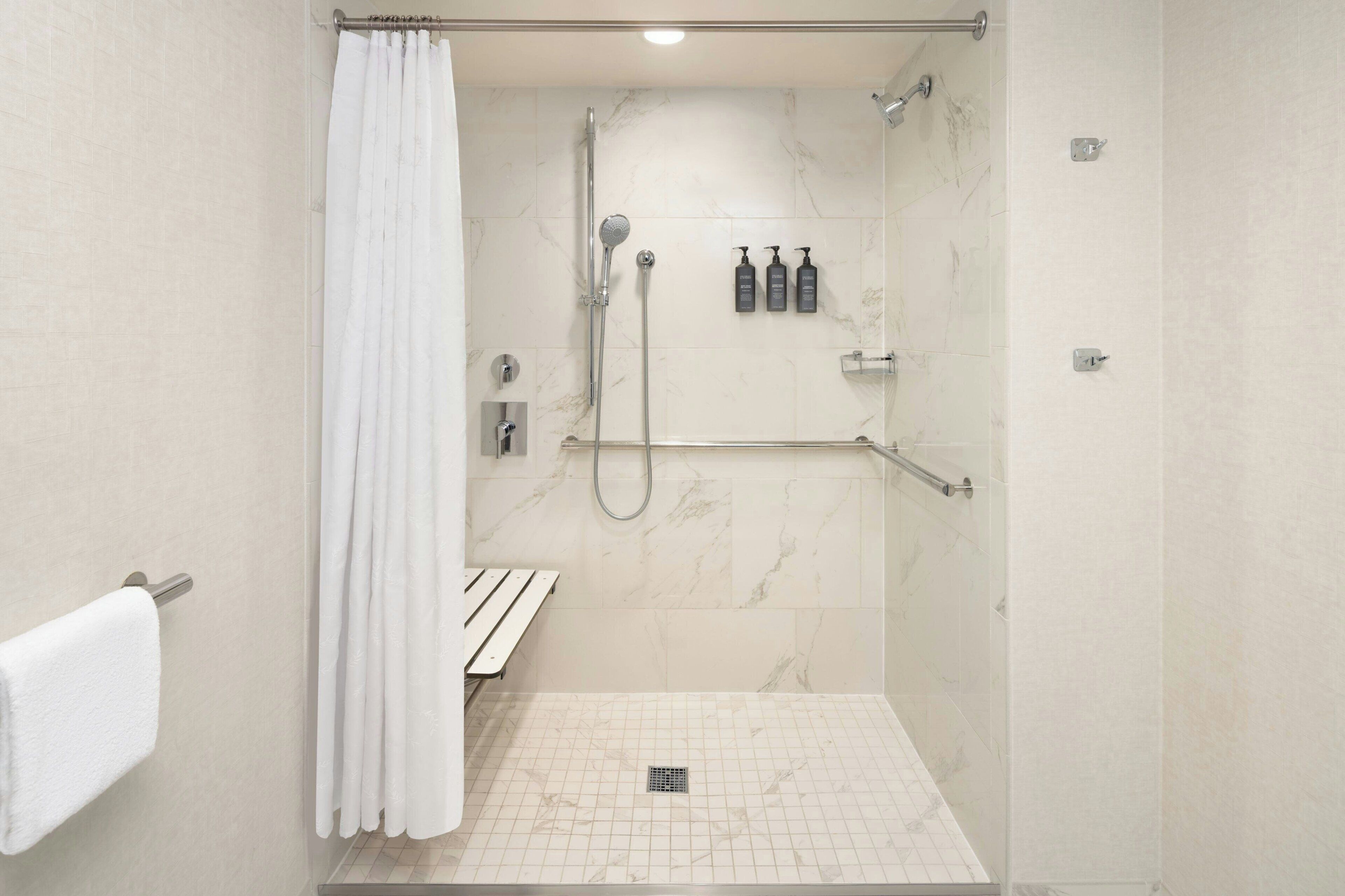 A walk-in shower with a white curtain, a handheld showerhead, a handheld showerhead, a handheld showerhead, a handheld showerhead, a handheld showerhead, a handheld showerhead, a handheld showerhead, a handheld showerhead, a handheld showerhead, a handheld showerhead, a handheld showerhead, a handheld showerhead, a handheld showerhead, a handheld showerhead, a handheld showerhead, a handheld showerhead, a handheld showerhead, a handheld showerhead, a handheld showerhead, a handheld showerhead, a handheld showerhead, a handheld showerhead, a handheld showerhead, a handheld showerhead, a handheld showerhead, a handheld showerhead, a handheld showerhead, a handheld showerhead, a handheld showerhead, a handheld showerhead, a handheld showerhead, a handheld showerhead, a handheld showerhead, a handheld showerhead, a handheld showerhead, a handheld showerhead, a handheld showerhead, a handheld shower