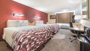 A hotel room with two beds, a desk, a chair, a microwave, and a large mirror. - Red Roof Inn Seattle Airport - SEATAC (SeaTac)