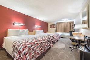 A hotel room with two beds, a desk, a chair, a microwave, and a large mirror. - Red Roof Inn Seattle Airport - SEATAC (SeaTac)