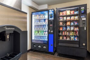 A vending machine area with a water dispenser and a snack vending machine. - Red Roof Inn Seattle Airport - SEATAC (SeaTac)