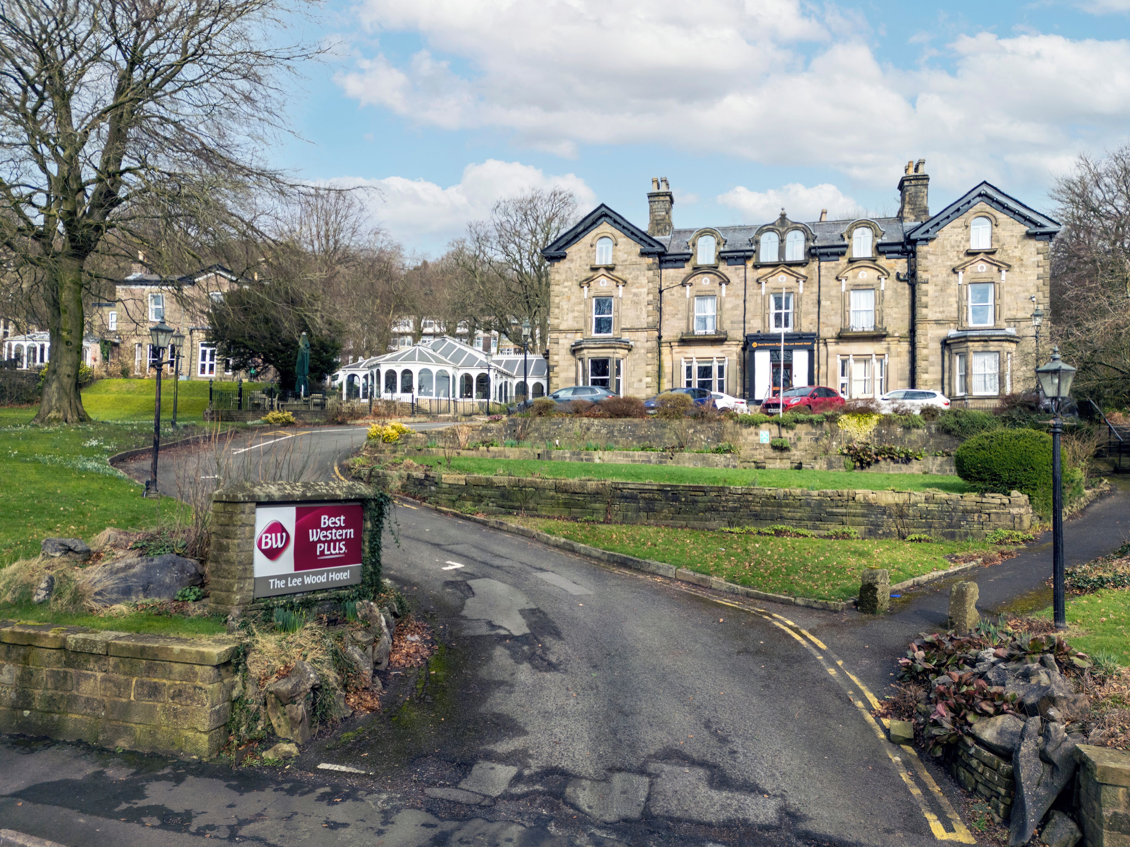 A historic building with a sign for The Lee Wood Hotel.
