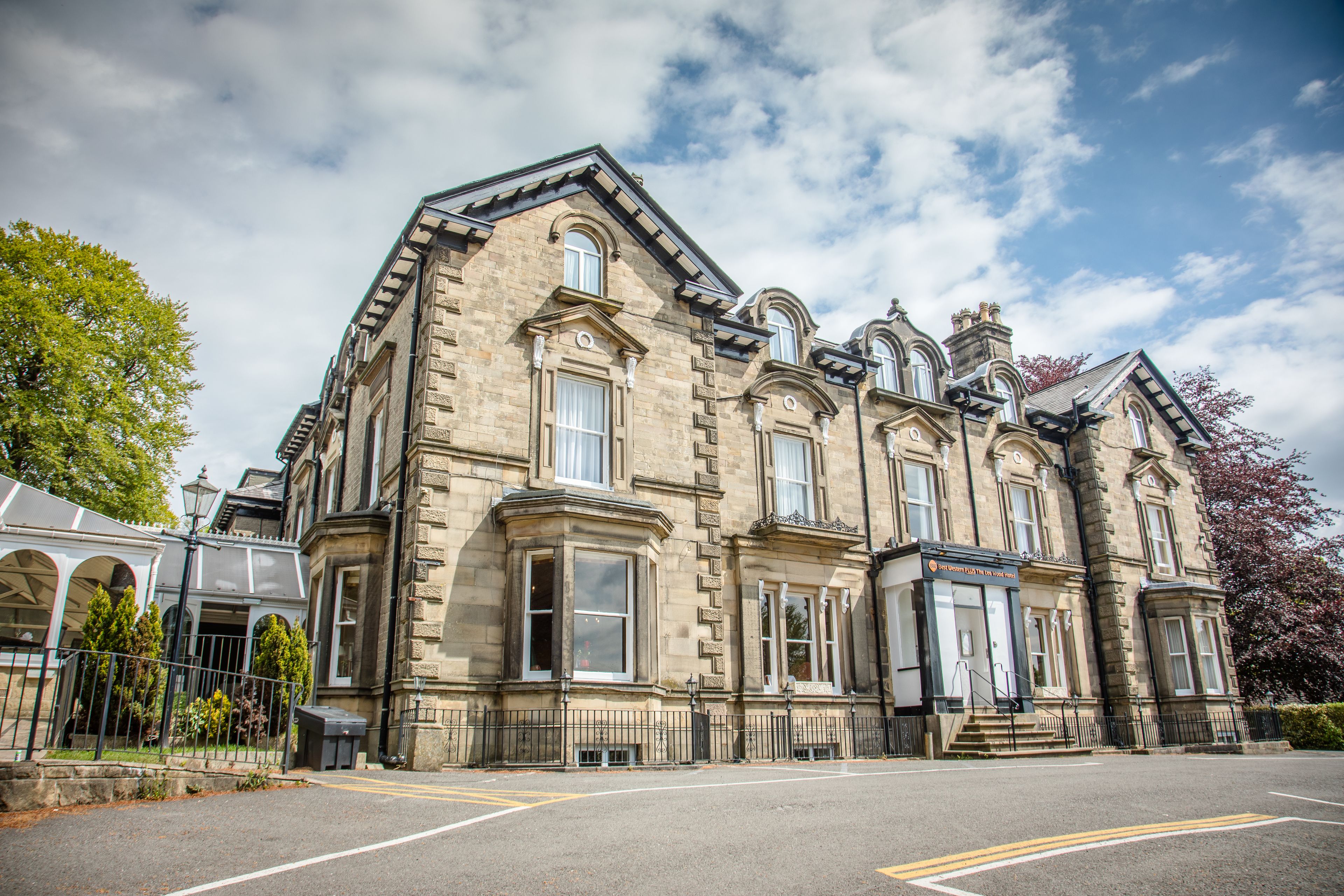 A historic building with large windows and a prominent entrance.