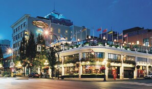 A historic building with a prominent 'Strathcona' sign, featuring a classic architectural style with large windows and a balcony. - Strathcona Hotel (Victoria)