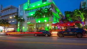 A hotel with a modern design, featuring a prominent 'Kent' sign, multiple floors, and a well-lit facade. - The Kent Hotel (Miami Beach)