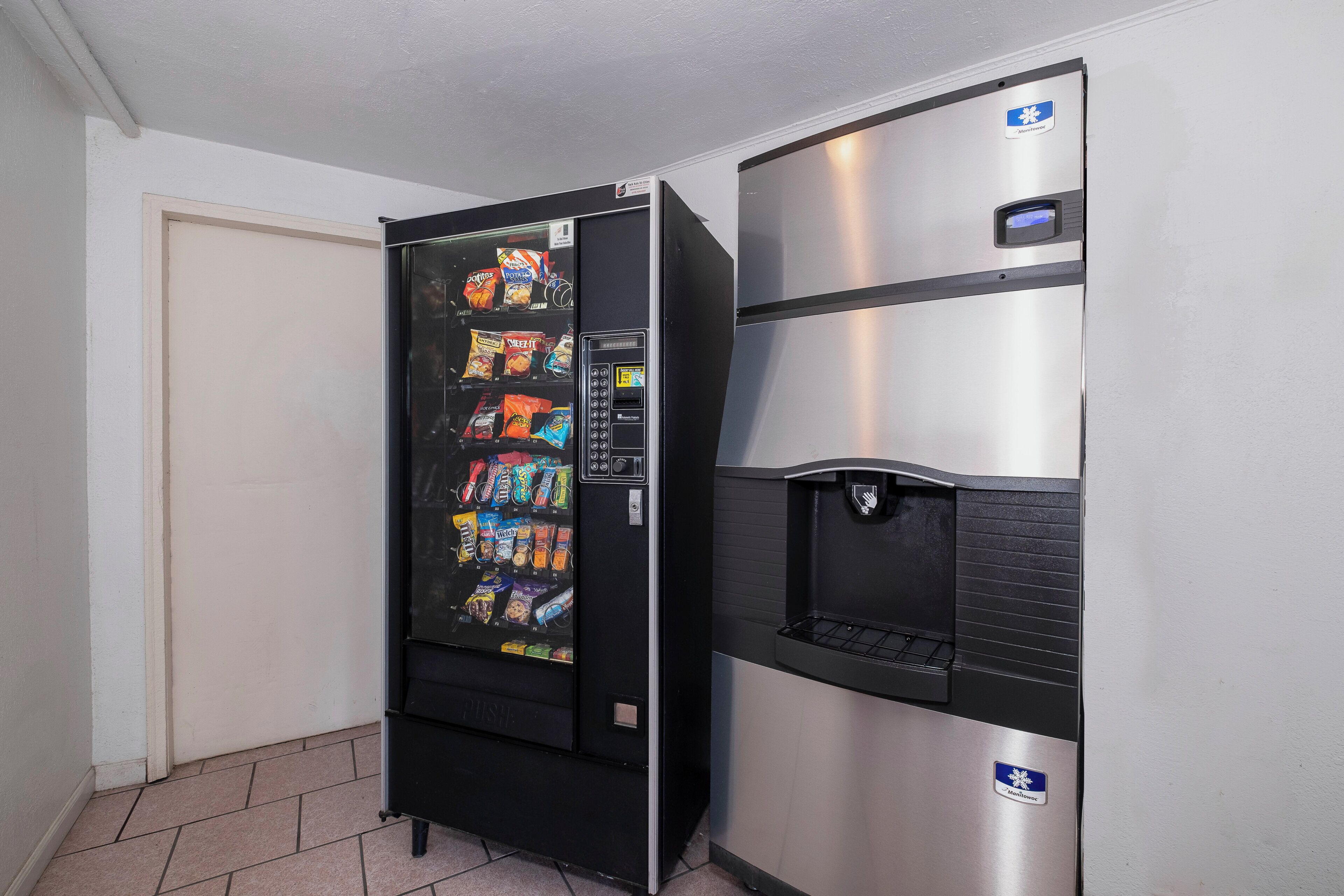 A vending machine with snacks and a water dispenser.