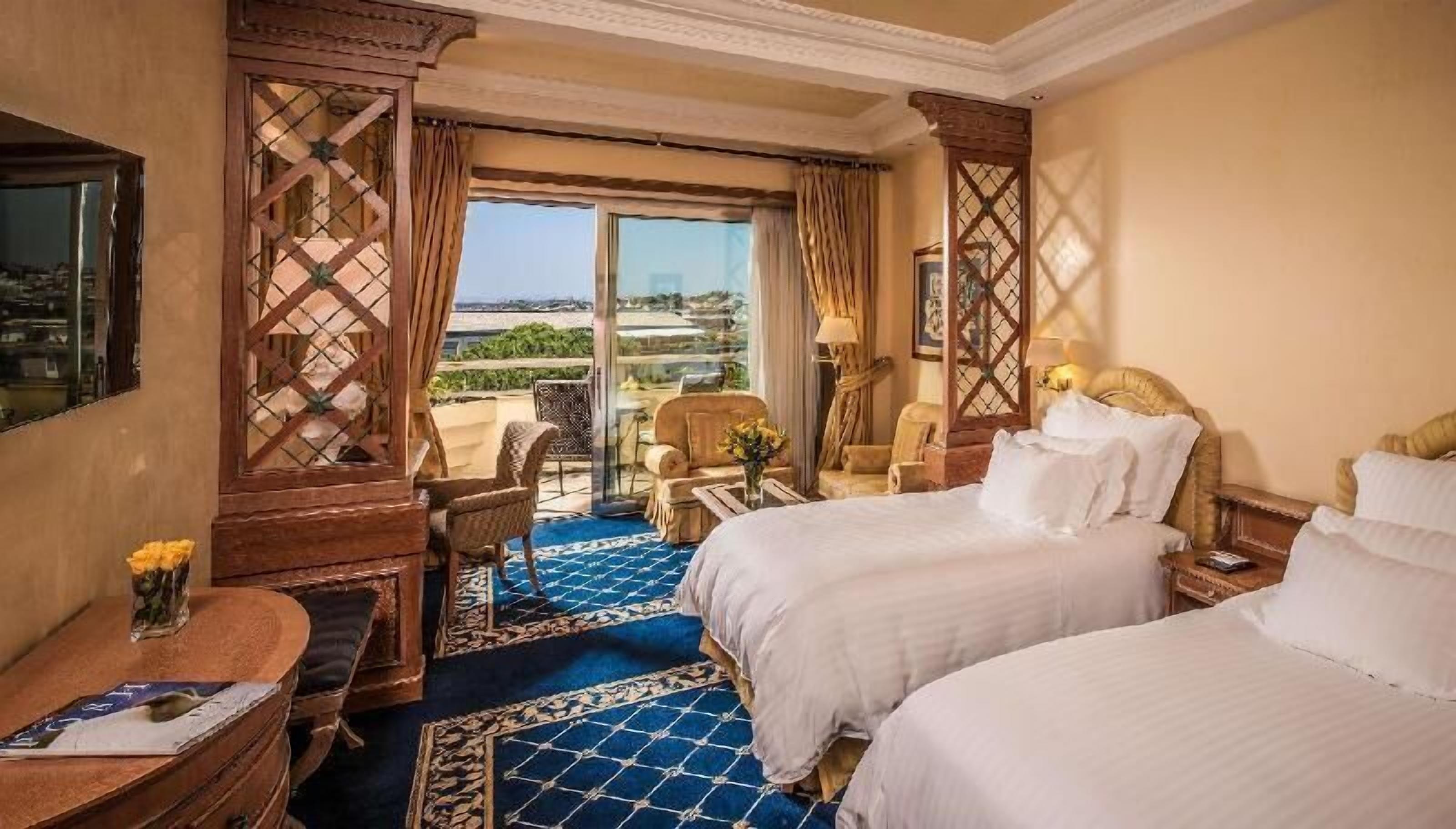 Premium bedding, down comforters, minibar, in-room safe