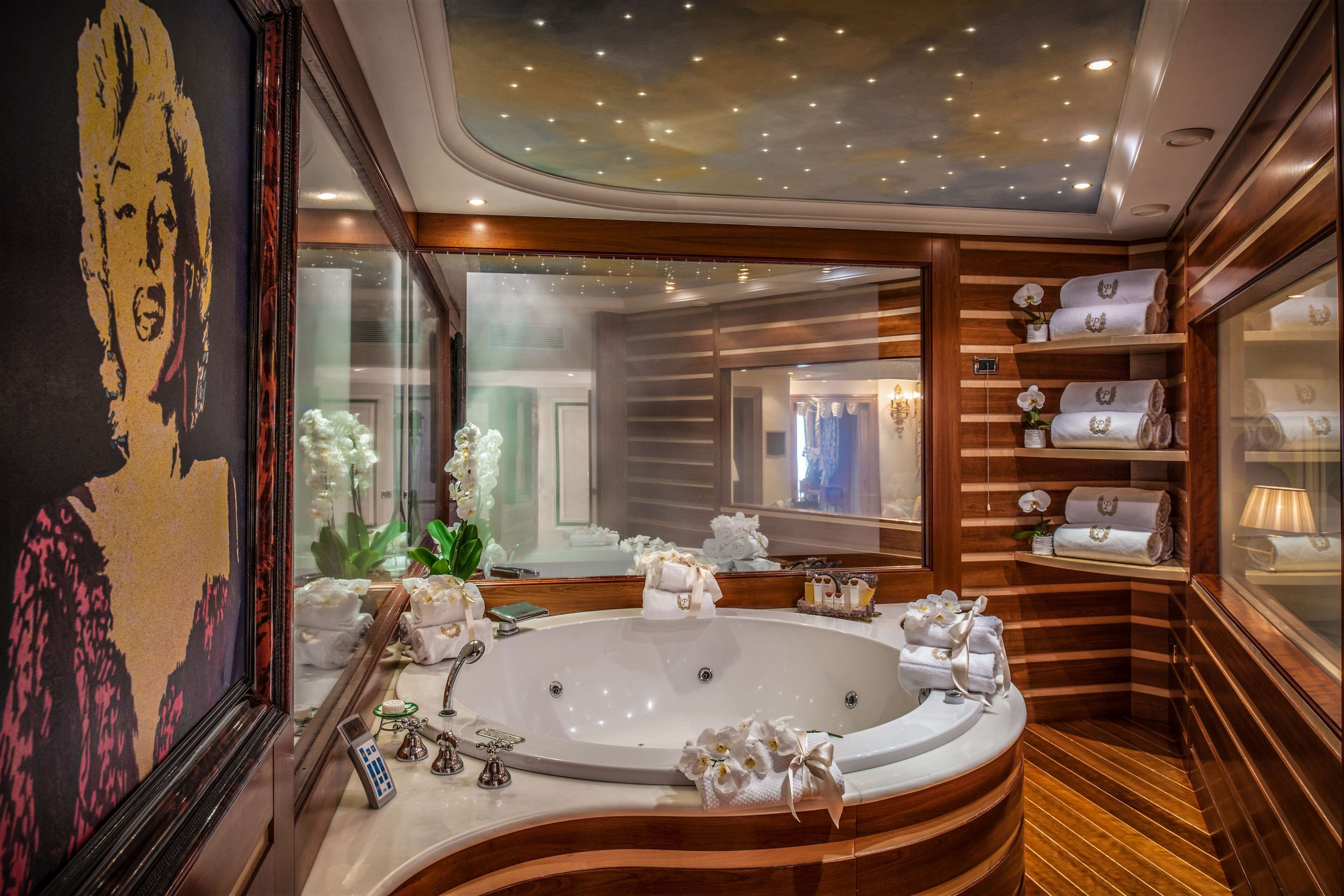 signature suite, 1 king bed (penthouse suite, spa | bathroom | combined shower/bathtub, designer toiletries, hair dryer, bathrobes