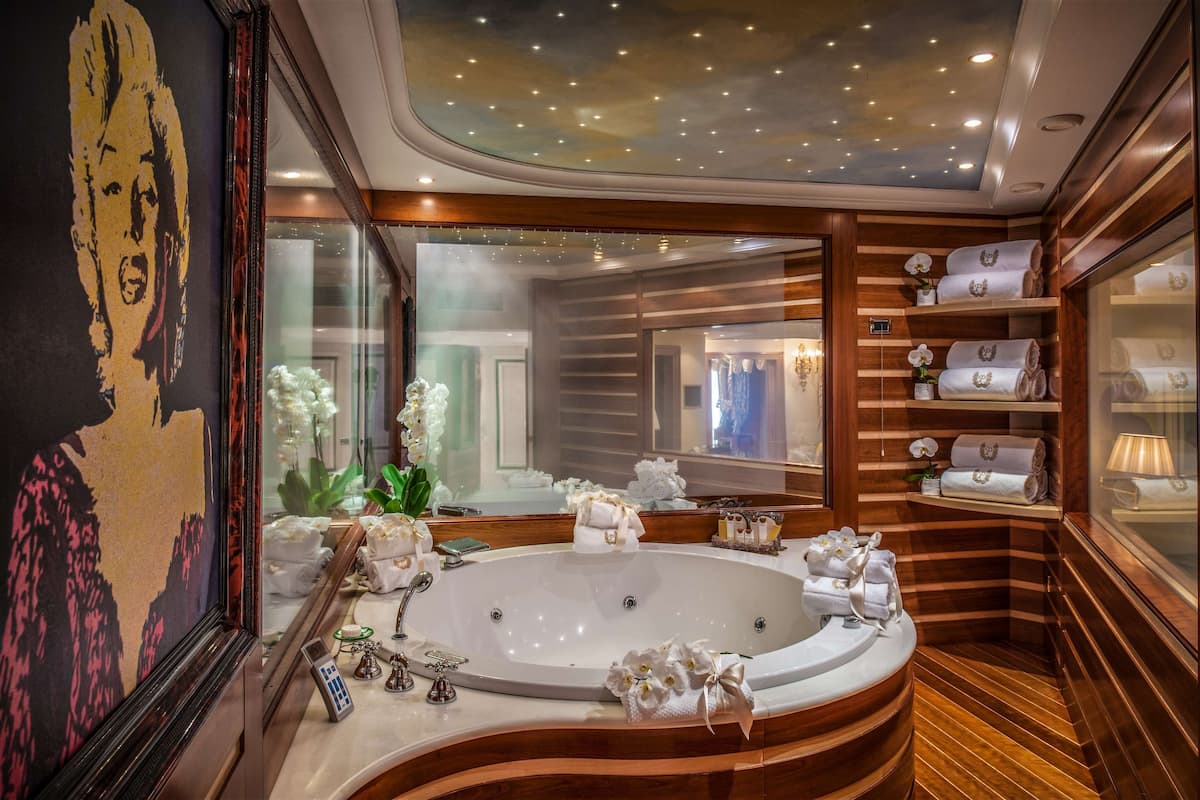 signature suite, 1 king bed (penthouse suite, spa | bathroom | combined shower/bathtub, designer toiletries, hair dryer, bathrobes