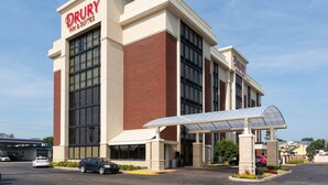 A Drury Inn & Suites building with a prominent entrance, large windows, and a covered walkway. - Drury Inn & Suites Terre Haute (Terre Haute)