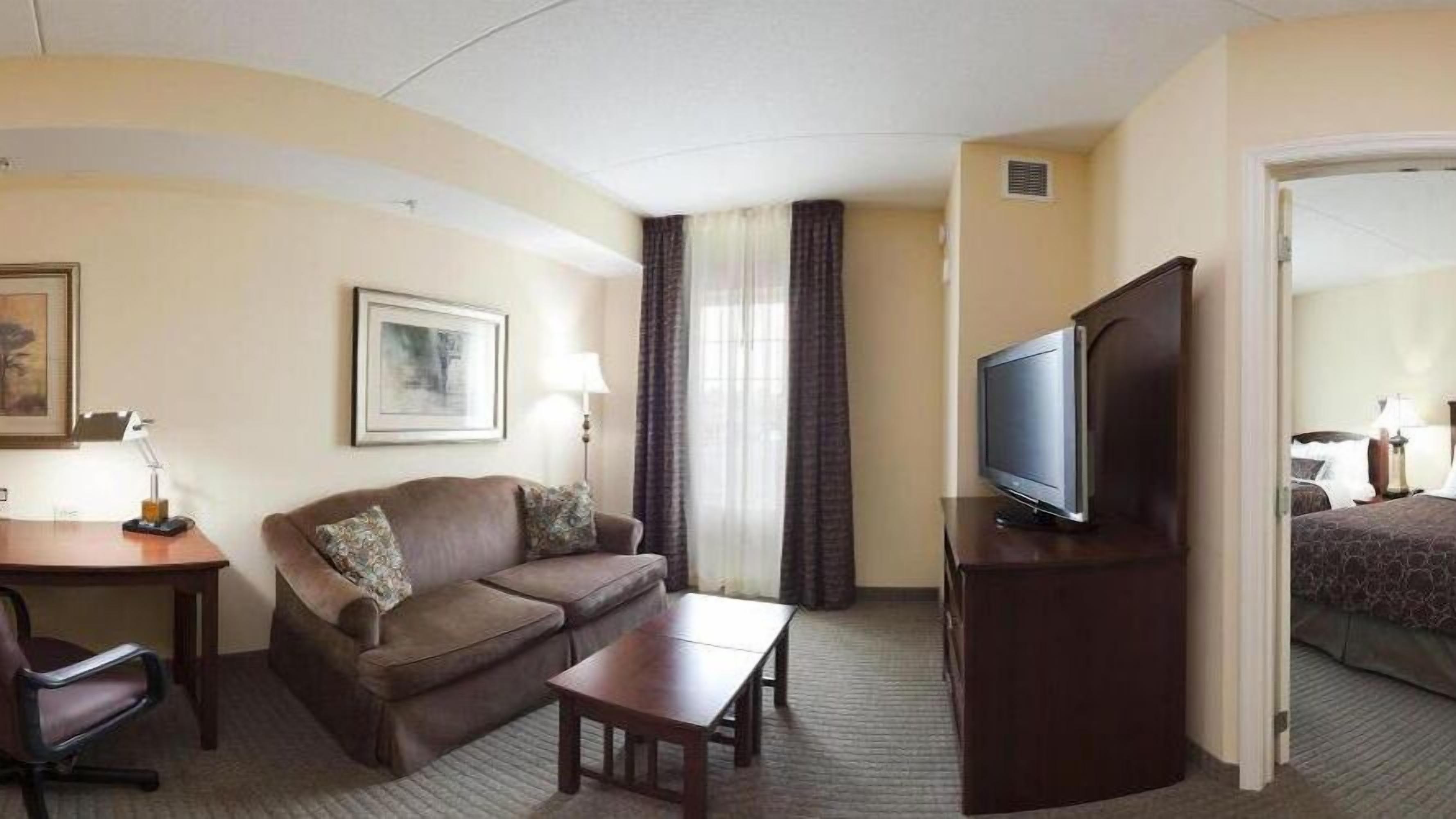 suite, 2 double beds | living room | 48-inch flat-screen tv with satellite channels, tv, dvd player