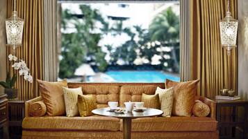 Premier Room | Living area | 42-inch LCD TV with satellite channels, TV, DVD player