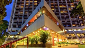 A multi-story hotel with a distinctive triangular entrance and a series of balconies. - Transcorp Hilton Abuja (Abuja)
