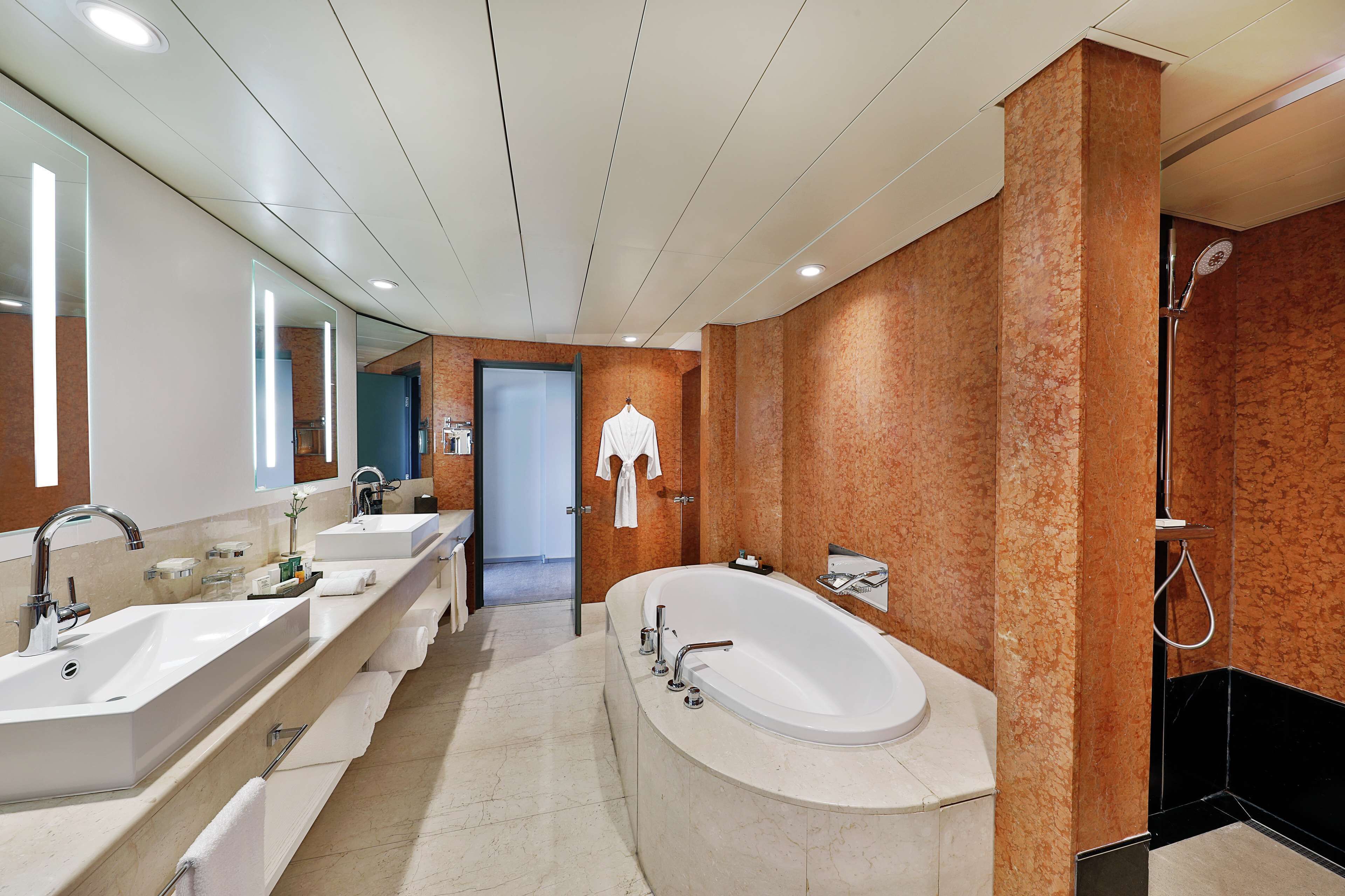 combined shower/bathtub, free toiletries, hair dryer, slippers