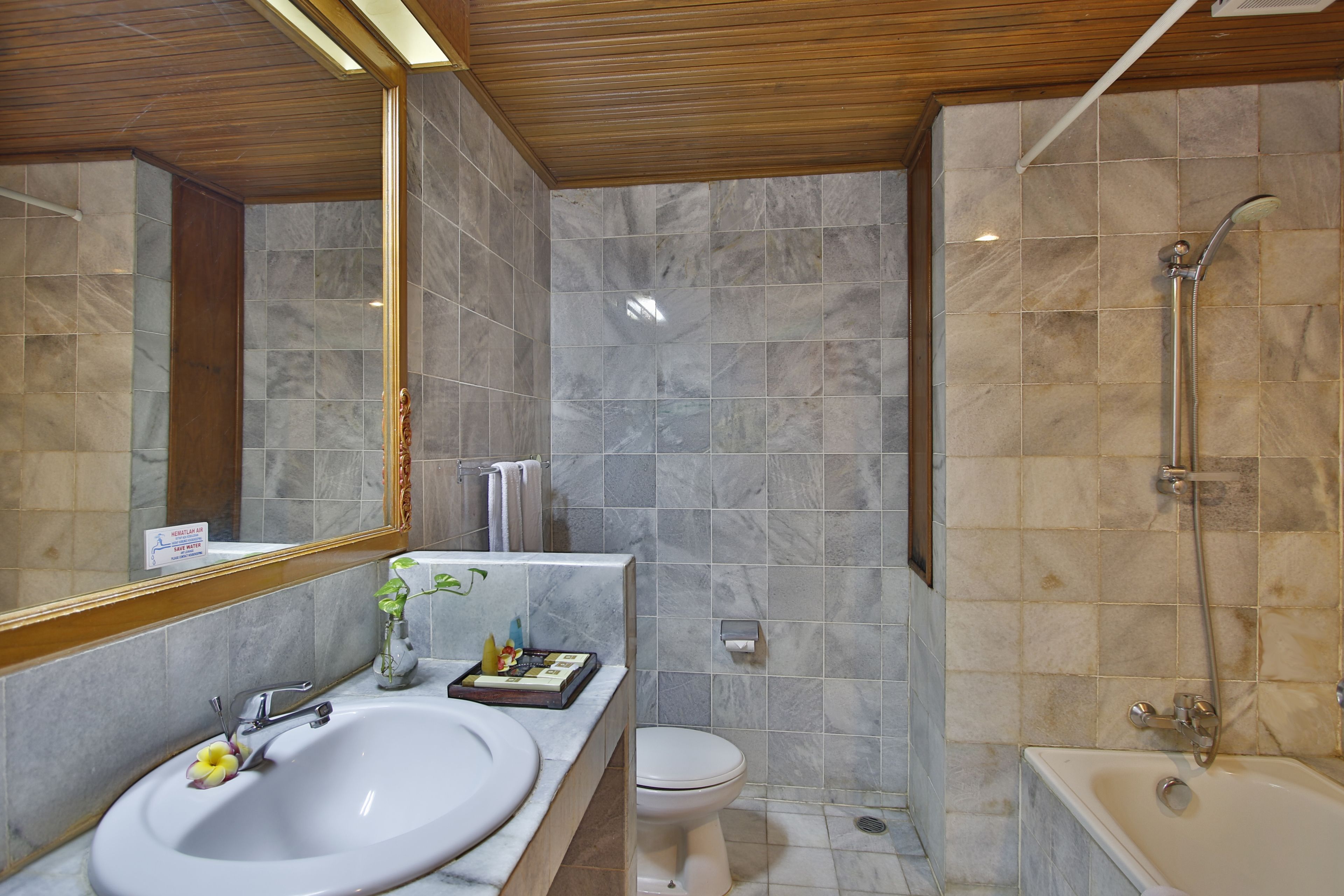 A bathroom with a sink, toilet, and bathtub.