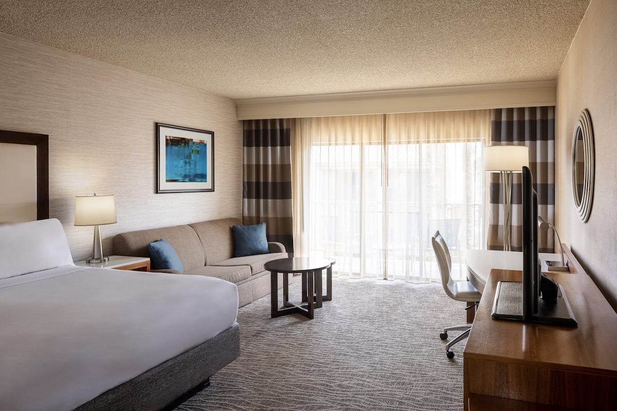 Standard Room, 1 King Bed with Sofa bed, Balcony, Courtyard View | 1 bedroom, premium bedding, desk, laptop workspace