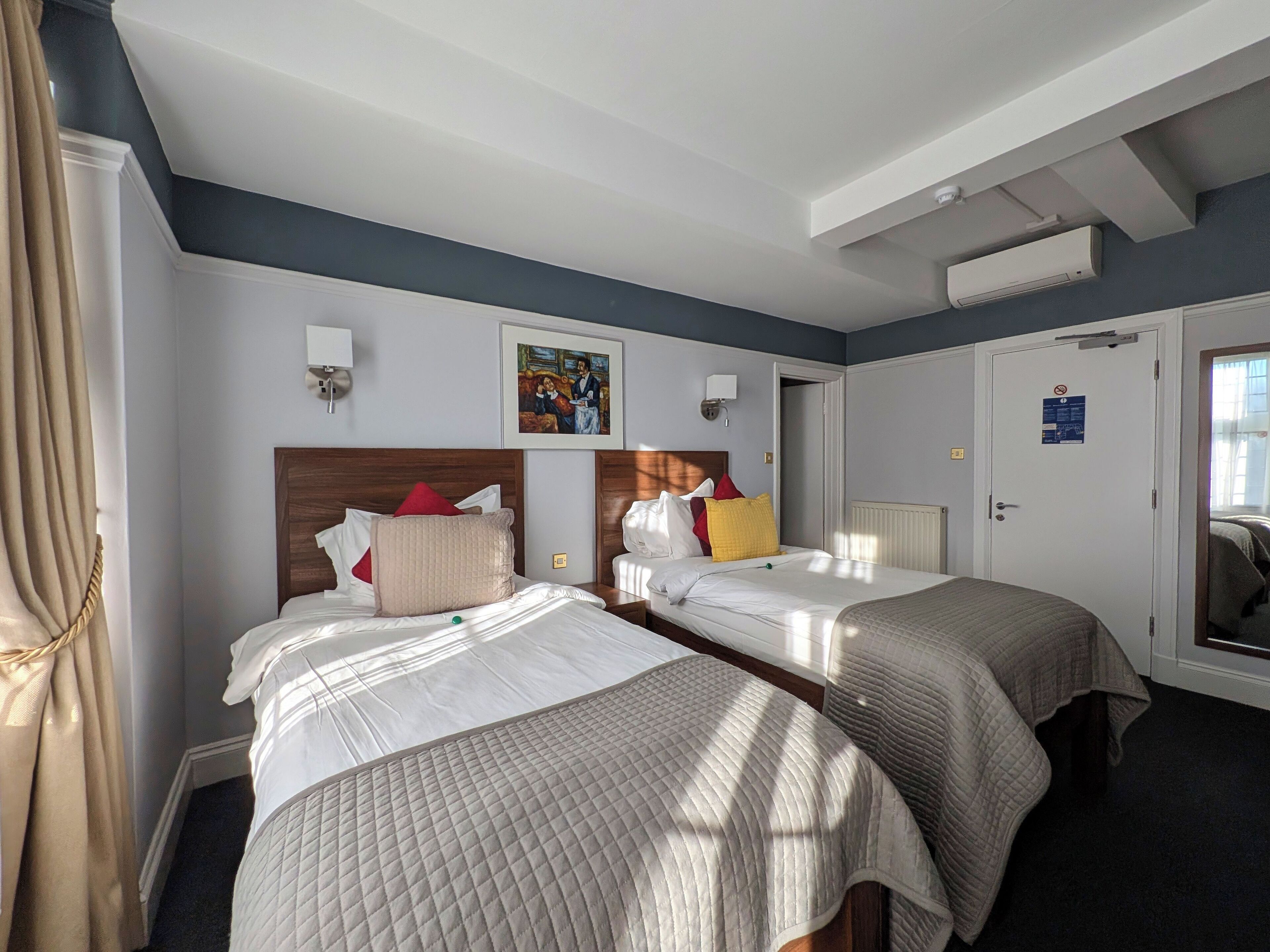 standard twin room | in-room safe, desk, blackout curtains, iron/ironing board