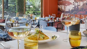 Breakfast, lunch, dinner served; Mediterranean cuisine, garden views