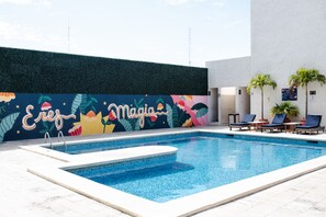 Outdoor pool, open 7 AM to 10:30 PM, pool loungers