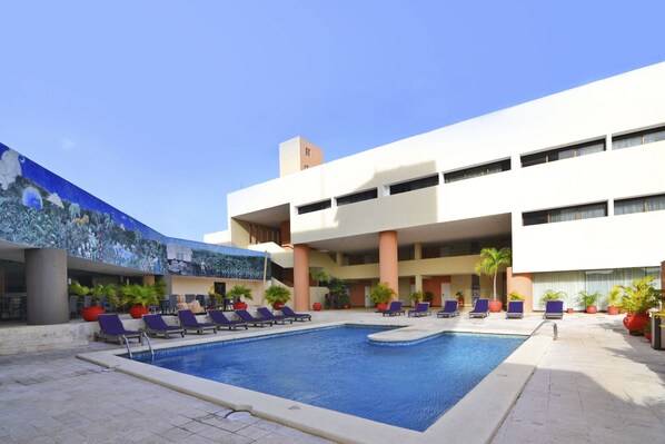 Outdoor pool, open 7 AM to 10:30 PM, pool loungers