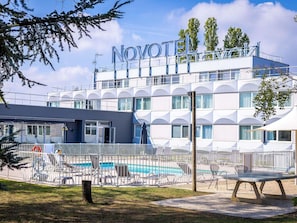 Seasonal outdoor pool, pool umbrellas, pool loungers