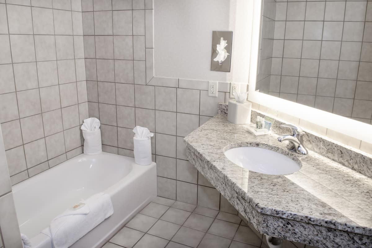 standard room, 2 queen beds, pool access | bathroom | free toiletries, hair dryer, towels