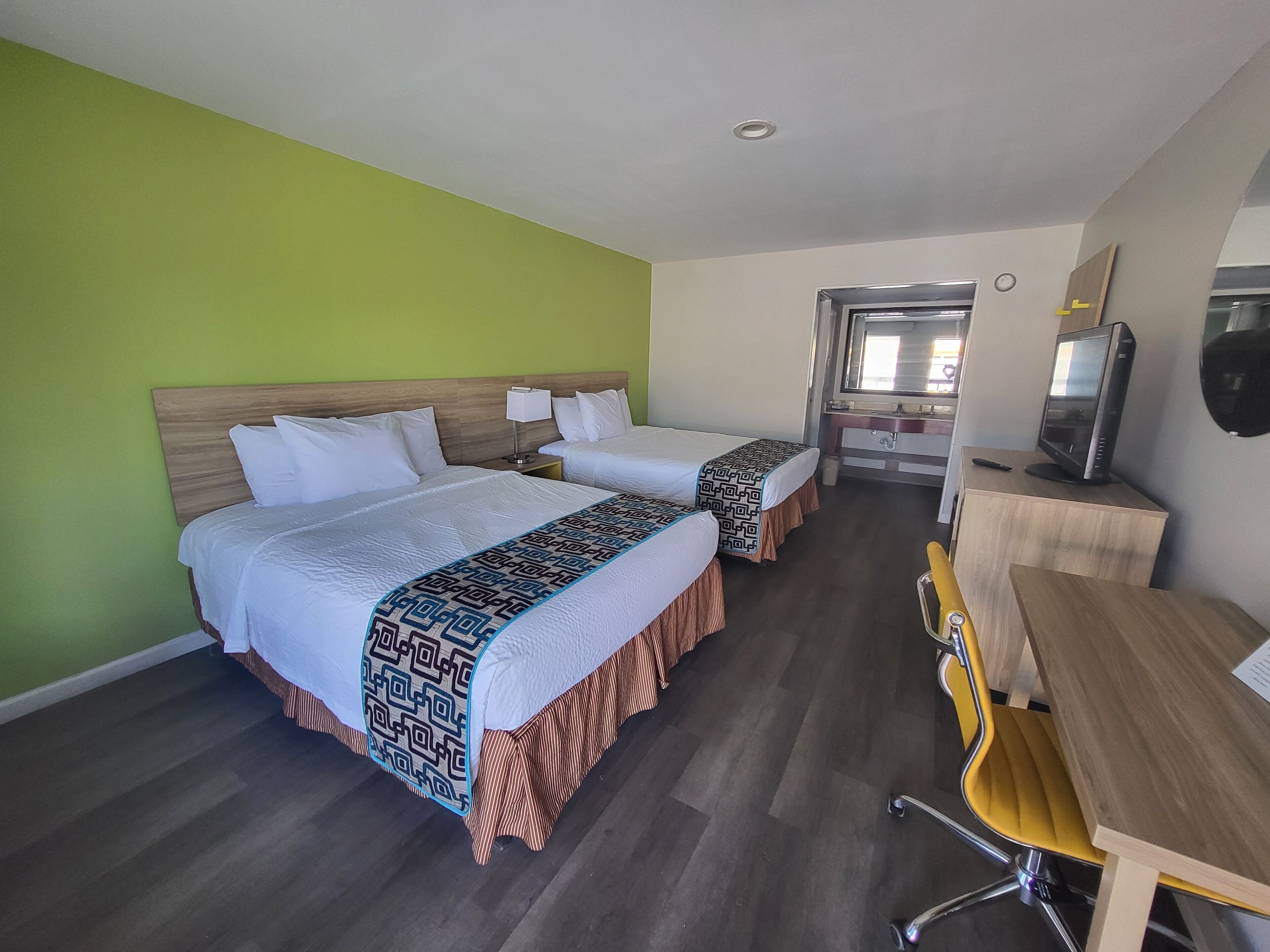 Standard Room, 2 Queen Beds, Non Smoking | In-room safe, desk, free cribs/infant beds, rollaway beds