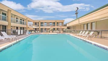 Outdoor pool, open 11:00 AM to 8:00 PM, pool loungers