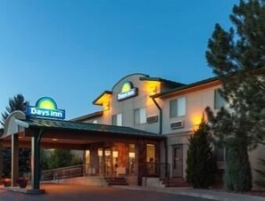 Welcome to Days Inn, featuring a simple, functional design with a covered entrance.