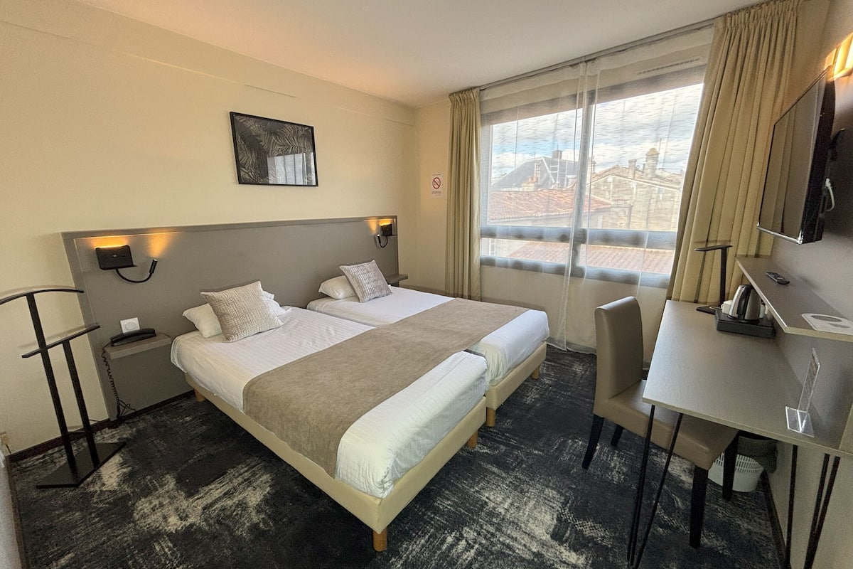 Comfort Twin Room | Minibar, desk, laptop workspace, soundproofing