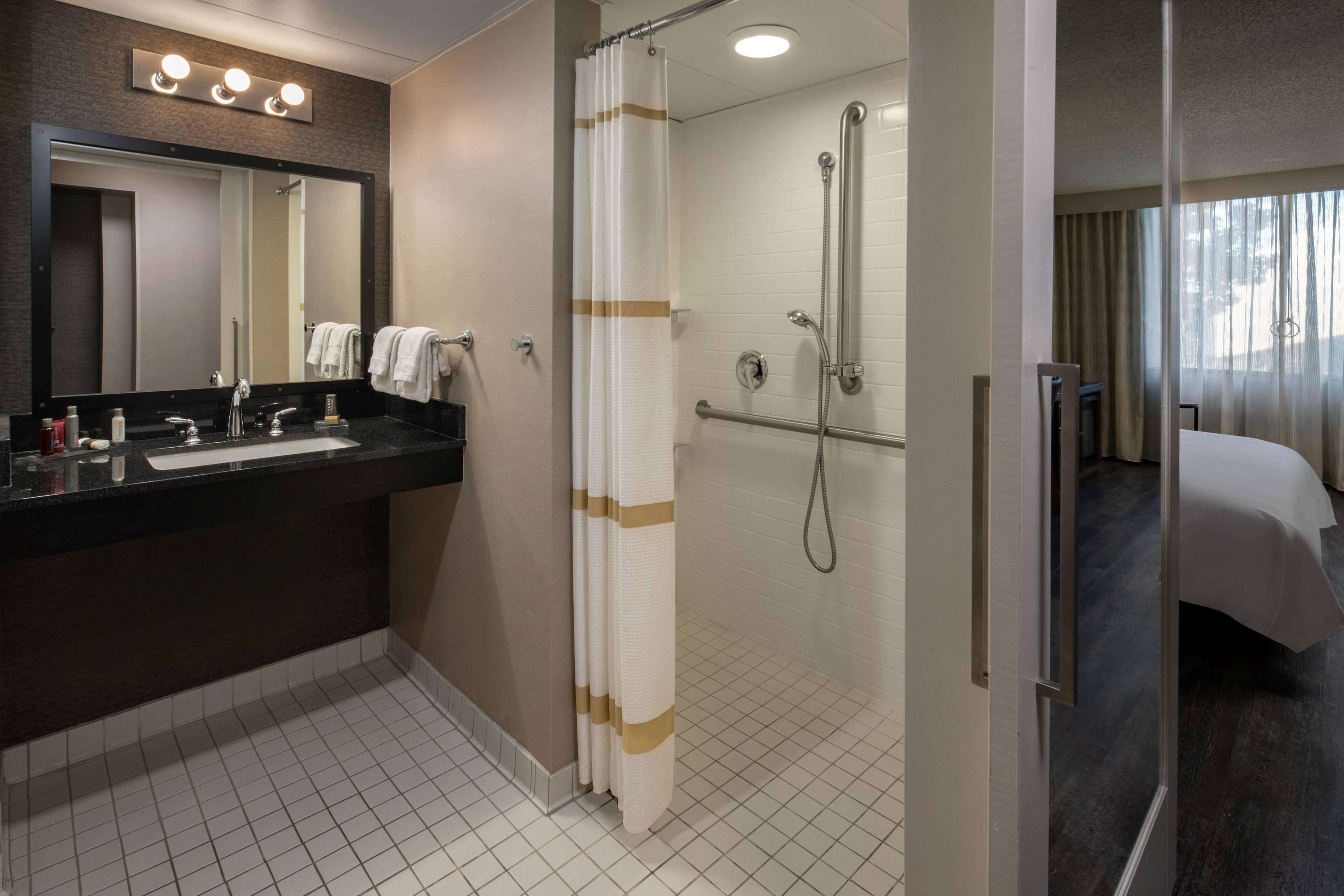 room, 1 king bed, accessible (mobility accessible - concierge) | bathroom | combined shower/bathtub, free toiletries, hair dryer, towels