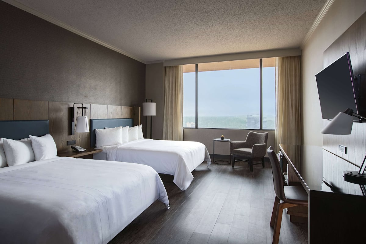 pillow-top beds, desk, laptop workspace, blackout curtains