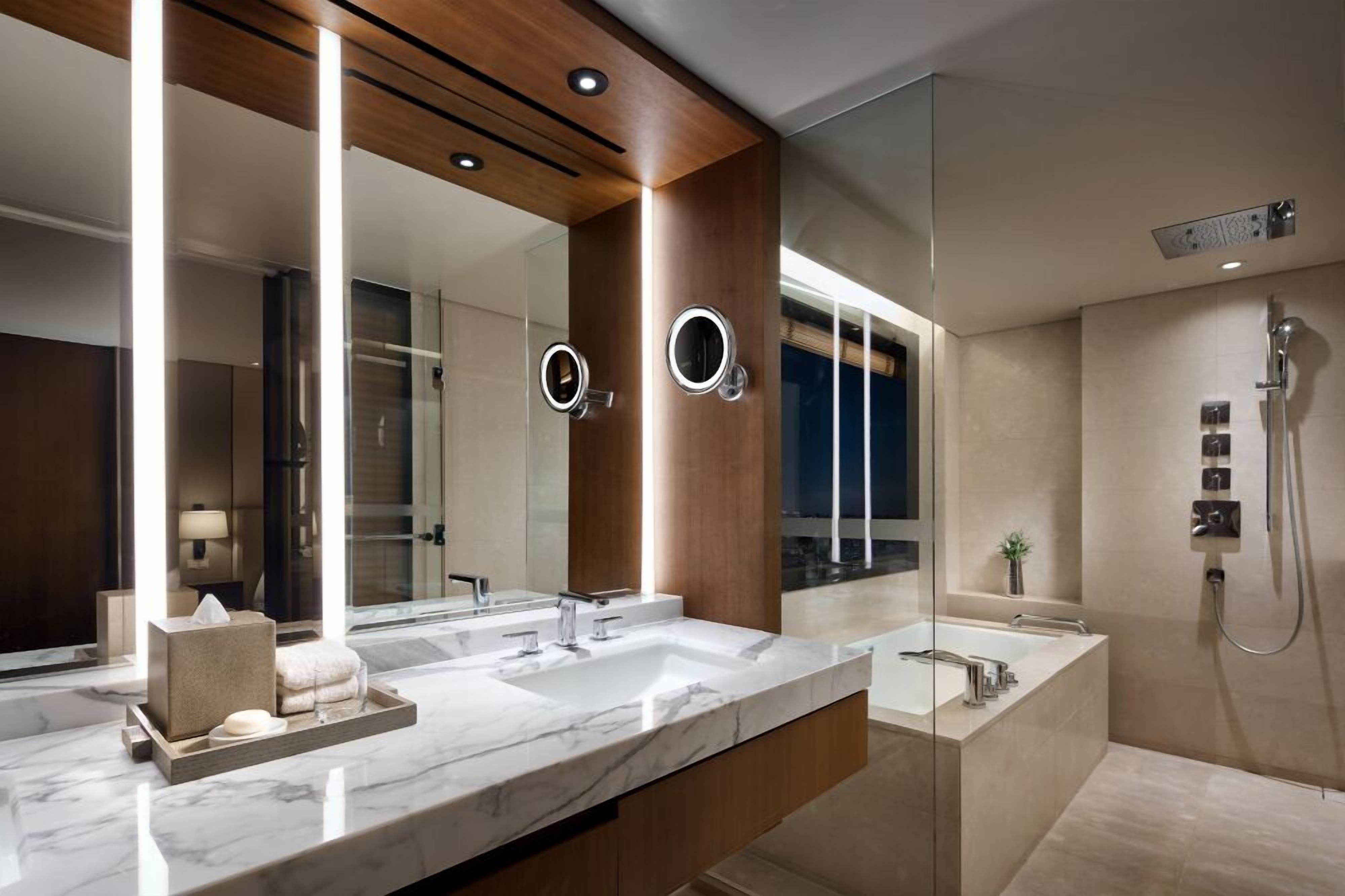 premier suite (outdoor pool access excluded) | bathroom | combined shower/bathtub, rainfall showerhead, hair dryer, bathrobes