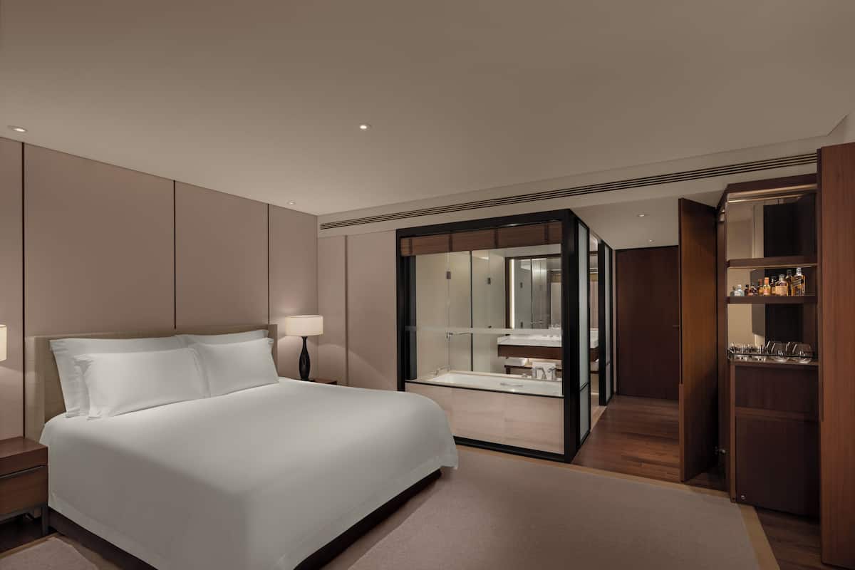 Premium bedding, down comforters, minibar, in-room safe