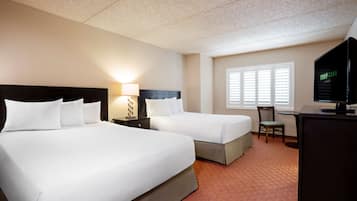 Desk, laptop workspace, iron/ironing board, bed sheets