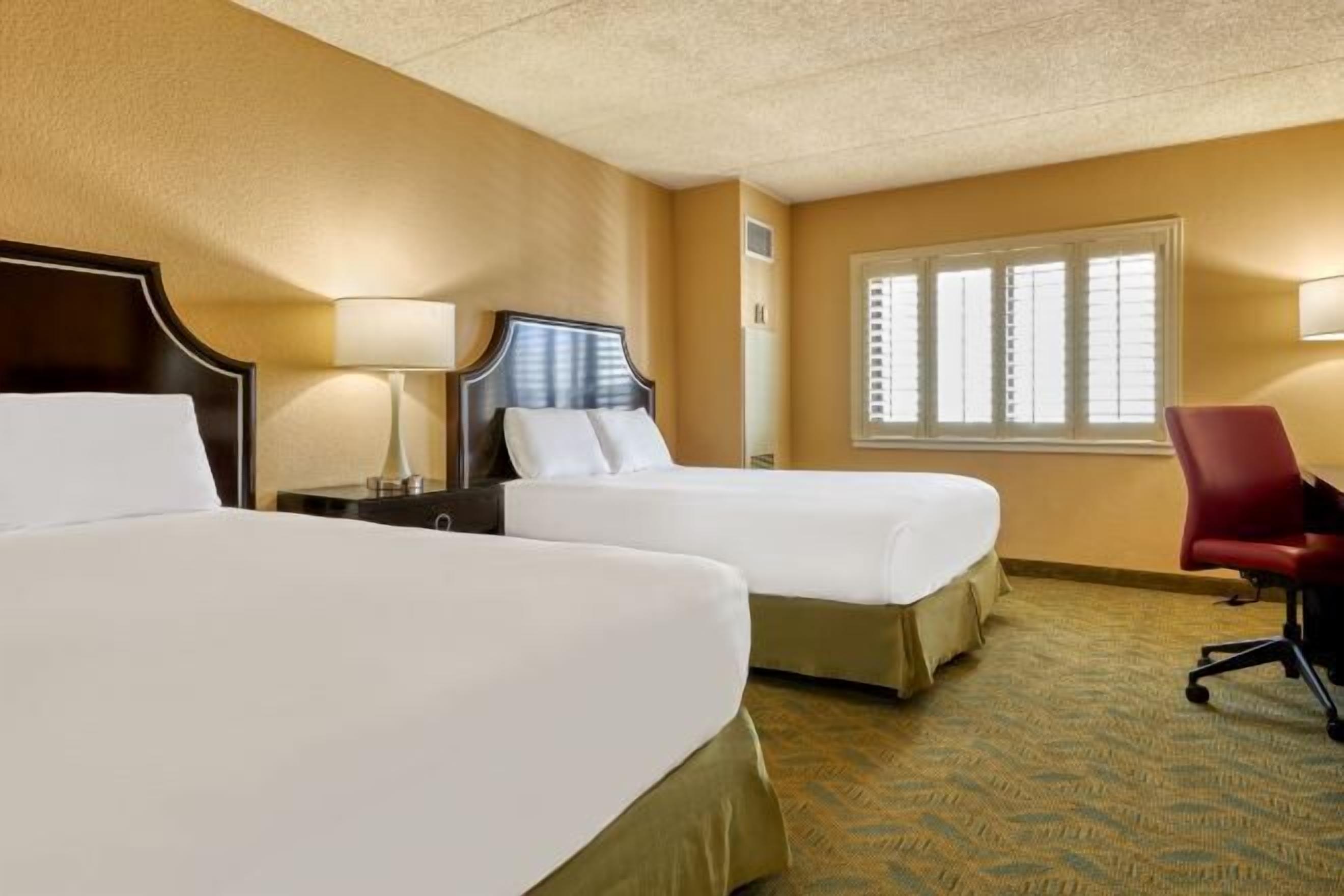 Desk, laptop workspace, iron/ironing board, bed sheets