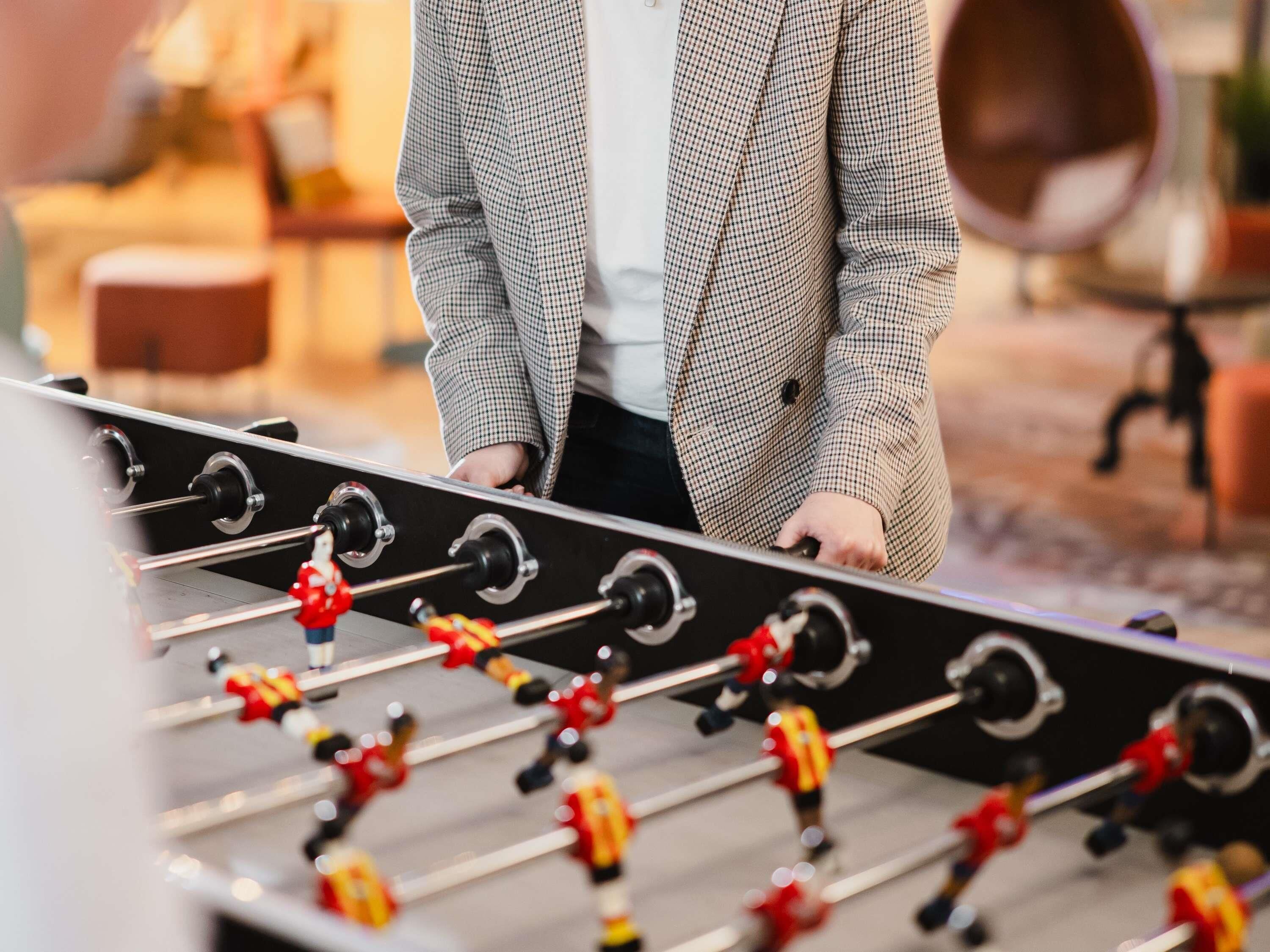 A foosball table in a room with a modern design.