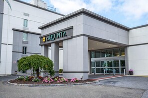 A modern building with a sign reading 'LA QUINTA'. - La Quinta Inn & Suites by Wyndham Danbury (Danbury)