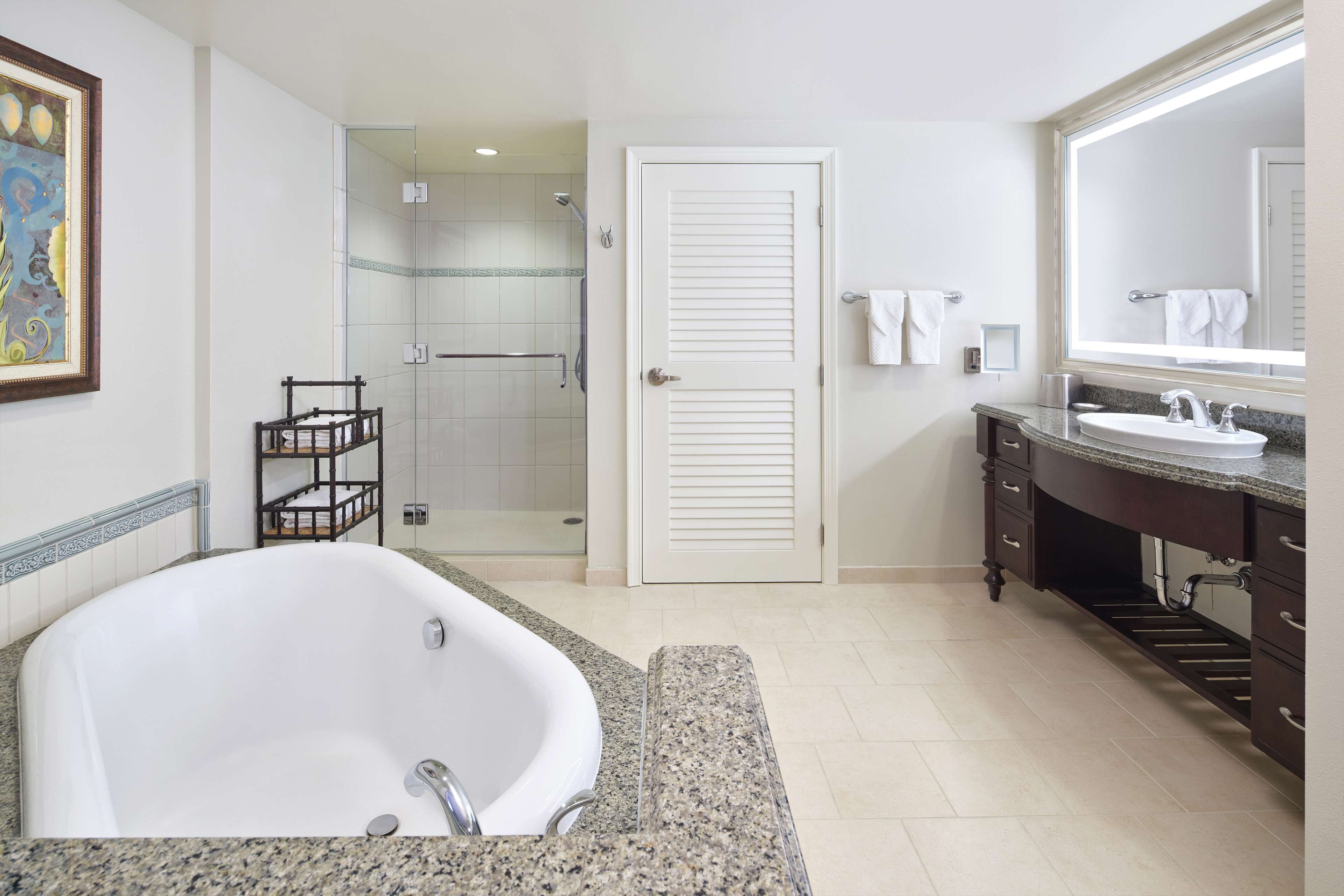 separate bathtub and shower, deep-soaking bathtub, designer toiletries