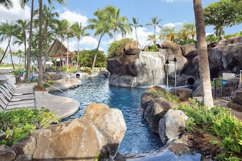 4 outdoor pools, pool umbrellas, sun loungers at Hilton Grand Vacations Club Grand Waikikian Honolulu