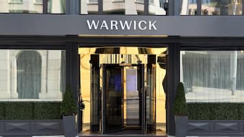 The entrance to a building with a sign that reads 'WARWICK'.