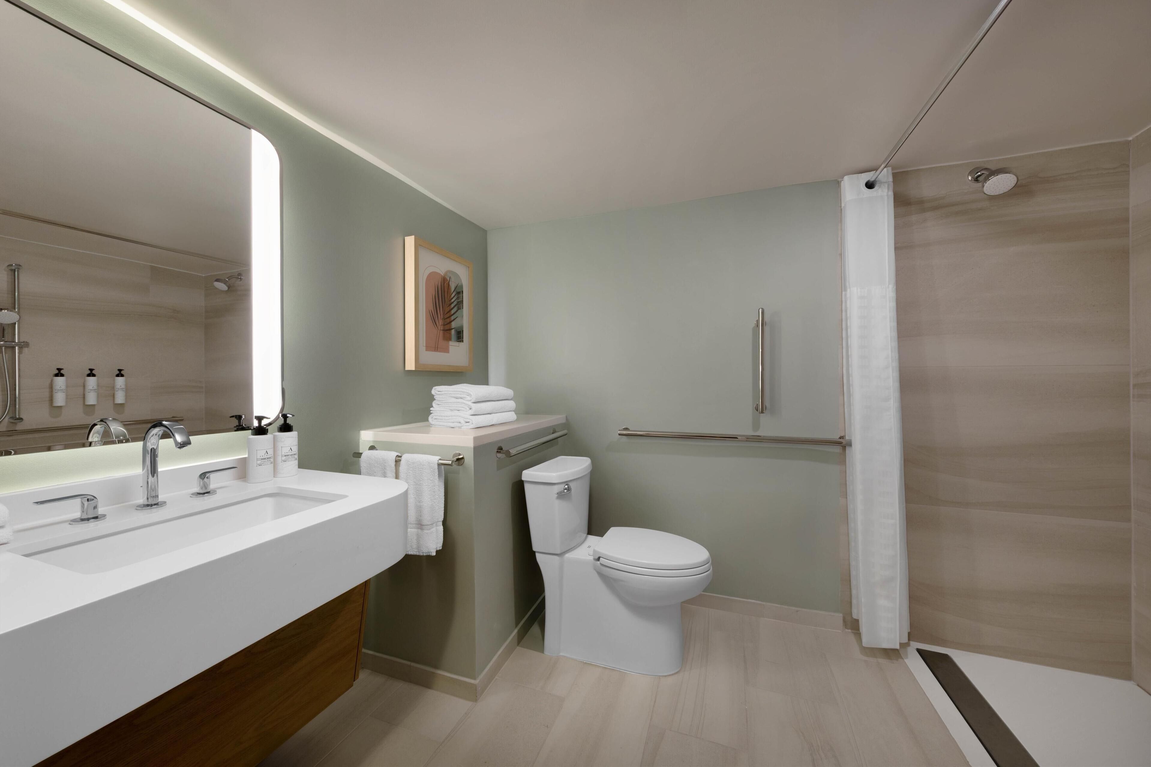 room, 1 king bed, accessible (mobility roll in shower) | in-room safe, desk, laptop workspace, blackout curtains