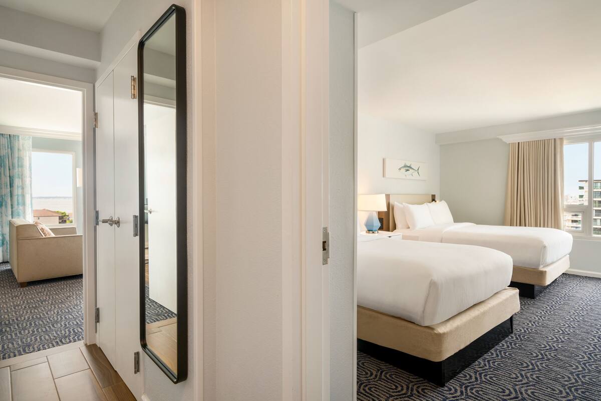 Premium Suite, Balcony, Oceanfront (1 King Bed and 2 Queens) | In-room safe, desk, laptop workspace, blackout curtains