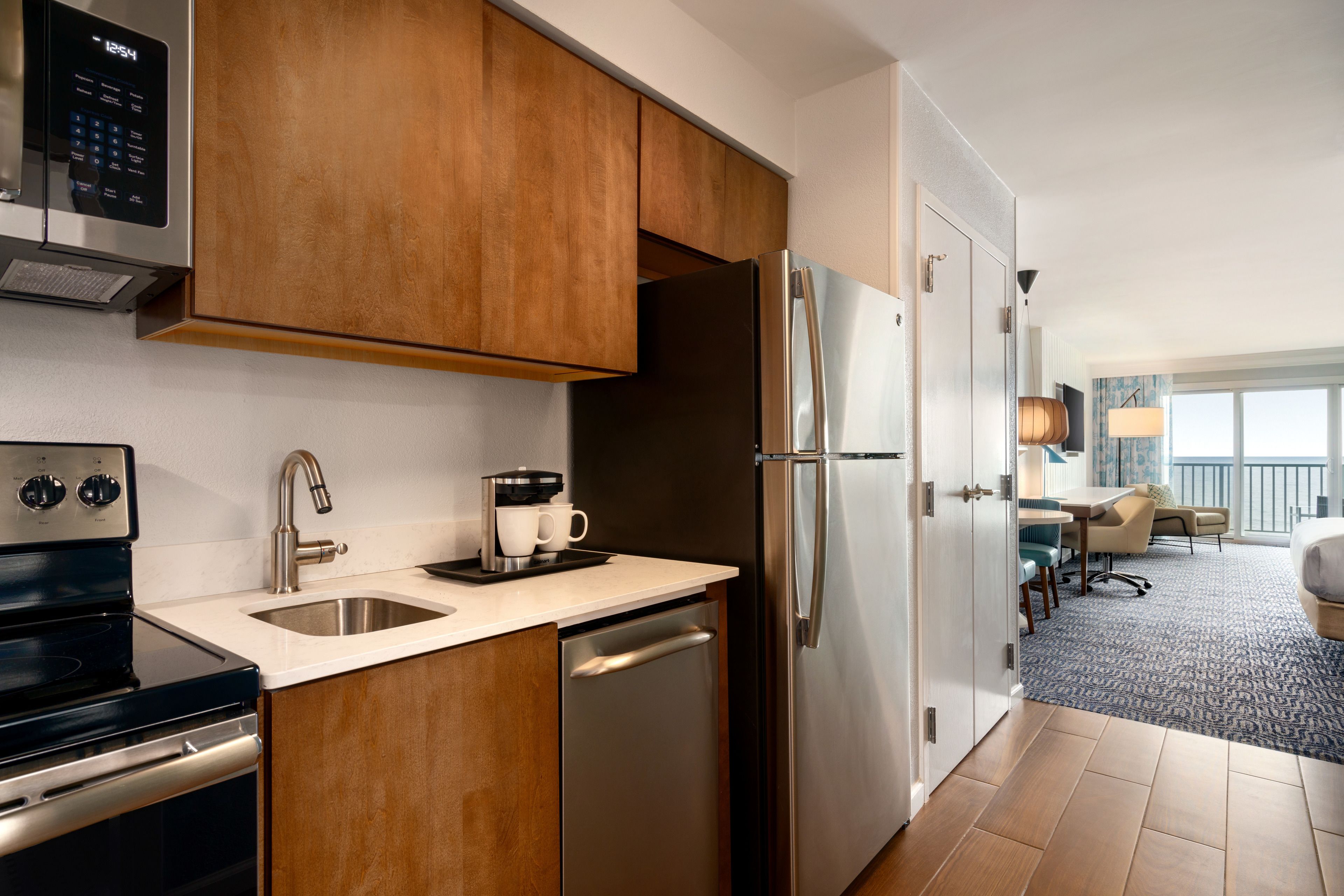 full-sized fridge, microwave, stovetop, dishwasher