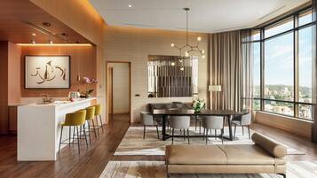 A modern interior with a dining area, kitchen, and seating space.