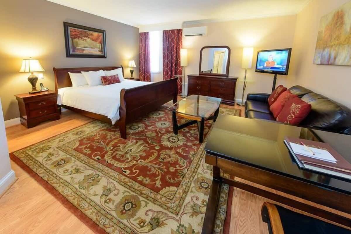 Suite, 1 King Bed with Sofa bed, Refrigerator | 1 bedroom, individually furnished, blackout curtains, iron/ironing board